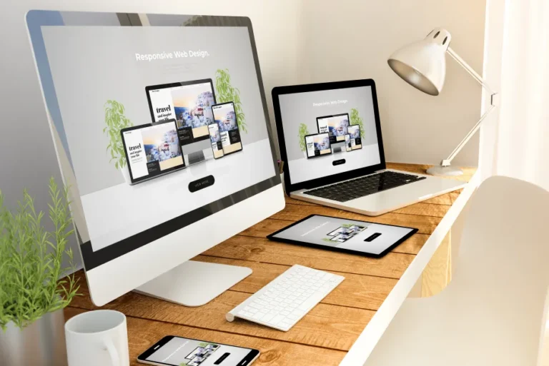 Responsive website design displayed on desktop, laptop, and tablet screens
